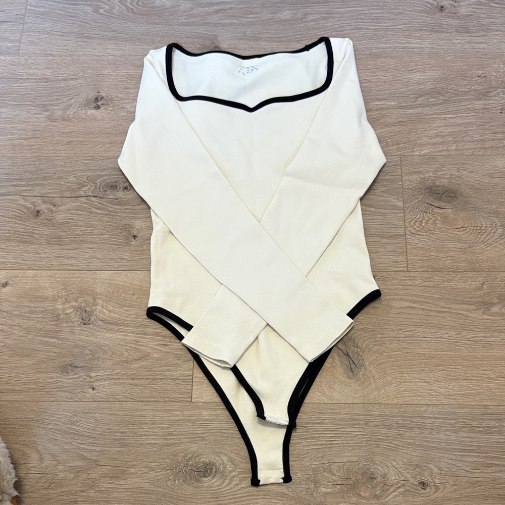Cream Long-Sleeve Baby Bodysuit with Black Trim